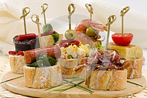 Spanish Cuisine. Tapas. Tray of montaditos. photo