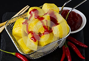 Spanish Cuisine. Traditional fried potatoes in hot sauce. Patatas Bravas