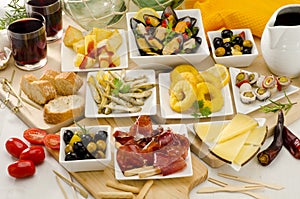 Spanish Cuisine. Variety of tapas on white plates.