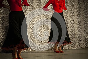 Spanish dance. Girls dancing in black dresses. Dance lesson. Spanish traditions. Red clothes