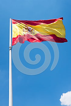 Spanish flag with a cloud on the sky