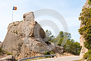 The Spanish flag Estelada on the mountain, over blue sky background, Catalunya, Spain. Copy space.