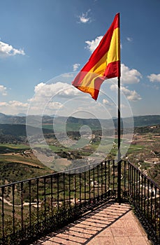 Spanish flag flying over Ronda in Spain