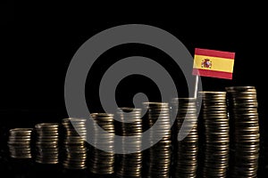 Spanish flag with lot of coins on black