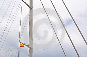 Spanish flag in mast of large sailing yacht