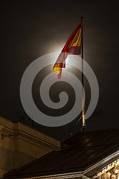 Spanish flag with the moon at night