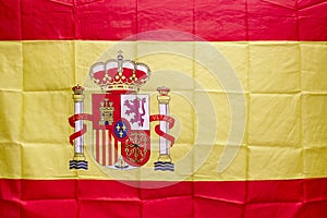 Spanish flag with shield and royal crown. Constitutional monarch