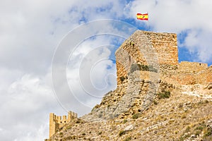 Spanish flag on top of the Murallas tower in Albarracin photo