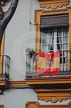 Spanish flag on a traditional building in Seville, Spain
