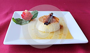 Spanish Flan Postre Dessert with strawberries photo