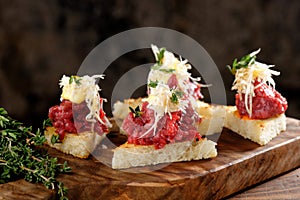 Spanish food tapas. Toasted bread with meat