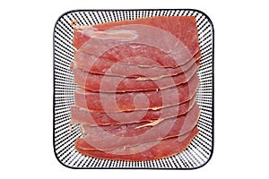 Spanish food. Top view of pieces of sliced dry spanish ham Jamon Serrano or italian parma prosciutto crudo on a plate isolated