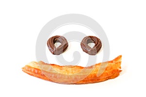 spanish fritters on a smile face with white background