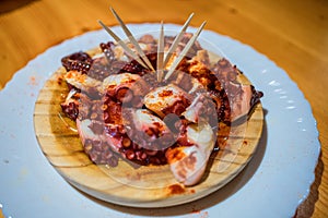 Spanish Galician Octupus tapa in a wooden dish