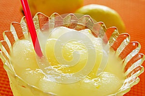 spanish granizado de limon, a semi frozen dessert made with lemon juice and sugar photo