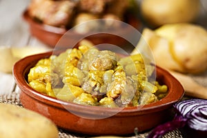 Spanish guiso de patatas con albondigas, a stew with potatotes a photo