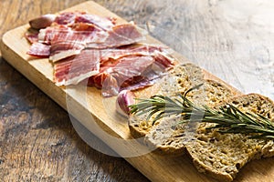 Spanish ham with toasts, focus on toasts