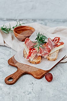 Spanish ham with toasts,rosemay,garlic photo