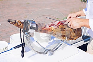Spanish Iberian ham or Pata Negra mounted on a wooden stand with