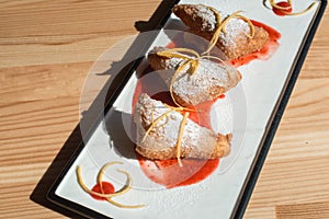 Spanish Leche Frita Dessert, decorated with jam close-up on a plate. photo