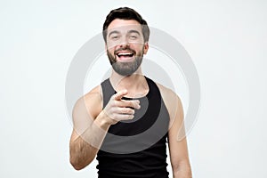 Spanish man mocking you or laughing on his friend joke photo