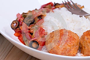 Spanish Meatballs albondigas with vegetables and photo