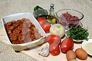 Spanish meatballs and raw ingredients. photo