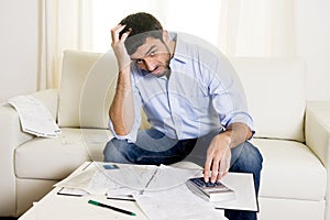 Spanish mexican business man worried paying bills on couch