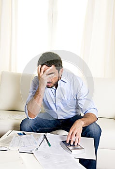 Spanish mexican business man worried paying bills on couch