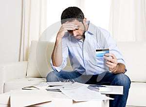 Spanish mexican business man worried paying bills on couch