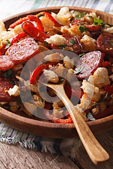 Spanish migas close-up on a plate. vertical