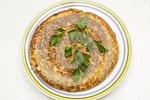 Spanish omelette with parsley photo