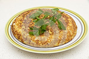 Spanish omelette with parsley photo