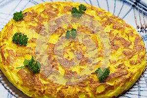 Spanish Omelette. Spanish omelette with potatoes and onion, typical Spanish cuisine. Spanish tortilla. photo