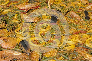 Spanish paella with rice and fishes