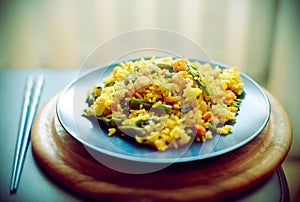 Spanish paella with seafood in a blue dish