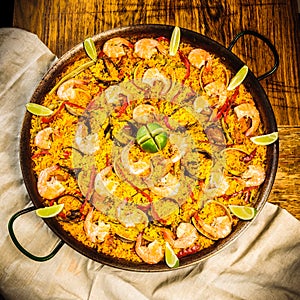 Spanish paella with seafood, rice and bell peppers photo