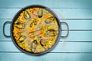 Spanish paella on a wooden table