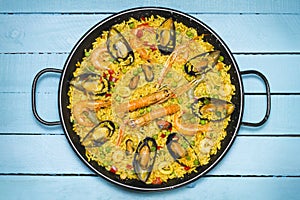 Spanish paella on a wooden table