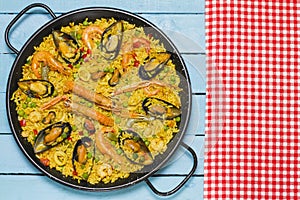 Spanish paella on a wooden table