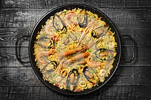 Spanish paella on a wooden table