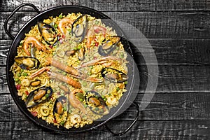Spanish paella on a wooden table