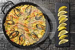 Spanish paella on a wooden table