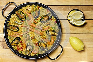 Spanish paella on a wooden table