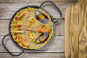 Spanish paella on a wooden table