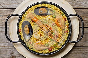 Spanish paella on a wooden table