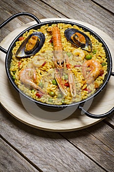 Spanish paella on a wooden table