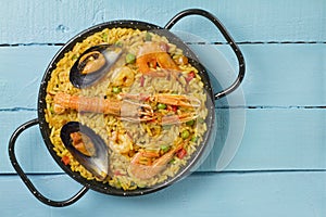 Spanish paella on a wooden table