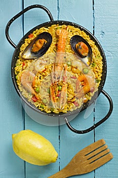 Spanish paella on a wooden table