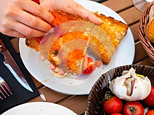 Spanish Pan con Tomate - cook rubs bread with tomatoes photo